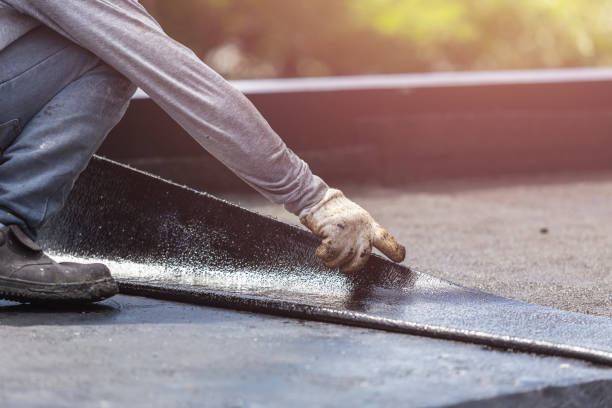 Professional Waterproofing technician working in Henderson, MI